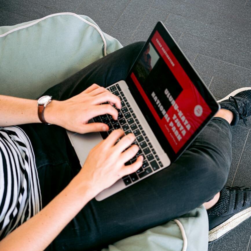 man creating a presentation on laptop